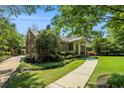 Well-maintained home with beautiful landscaping, a brick facade, and a welcoming walkway at 1821 N Rock Springs Ne Rd, Atlanta, GA 30324