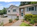 Lovely home boasting a charming stone facade, two-car garage, and beautifully landscaped front yard at 208 Bruce Ct, Dallas, GA 30157