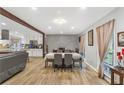 Dining area connected to kitchen, featuring modern decor and ample natural light at 2136 Briarwood Ct, Snellville, GA 30078