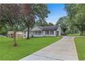 Lovely single-story home with a long driveway, beautiful lawn, and inviting curb appeal at 2136 Briarwood Ct, Snellville, GA 30078