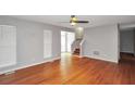 Living room with wood floors and stairway at 133 Harold Dr, Mcdonough, GA 30253