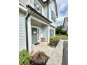 Inviting front entrance with a gray door, stylish wreath, and a 'Hey Y'all' welcome sign at , Covington, GA 30014