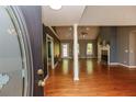 Spacious living room featuring hardwood floors, a fireplace, and ample natural light at 1252 Heritage Dr, Villa Rica, GA 30180