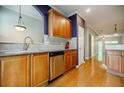 Kitchen with stainless steel appliances and hardwood floors offers great flow into adjacent rooms at 1293 Liberty Nw Pkwy, Atlanta, GA 30318