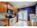 Well-equipped kitchen with stainless steel appliances, ample counter space, and a door to the backyard at 1293 Liberty Nw Pkwy, Atlanta, GA 30318