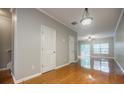 Open-concept living area with hardwood floors, natural light, and easy access to other rooms at 1293 Liberty Nw Pkwy, Atlanta, GA 30318