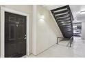 View of condo entrance with dark door, unit number 3108, and stairs to the upper levels at 3108 Westchester Ne Rdg, Atlanta, GA 30329