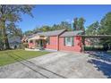 Charming home featuring a carport and a well-manicured front yard at 2055 Anderson Se Dr, Smyrna, GA 30080