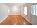 Bright living room with gleaming hardwood floors and fresh, neutral paint at 2055 Anderson Se Dr, Smyrna, GA 30080