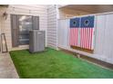 Inviting outdoor space featuring artificial turf and a custom cornhole game at 4846 Twin Lakes Trl, Atlanta, GA 30360