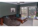 Comfortable living room featuring a large sectional sofa, natural light, and stylish decor at 4846 Twin Lakes Trl, Atlanta, GA 30360