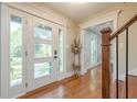 Bright entryway featuring hardwood floors, a modern door, and stylish decor at 4446 Huntington Cir, Atlanta, GA 30338