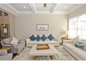 Inviting living room with modern furnishings, hardwood floors, and coffered ceilings at 4000 Chastain Preserve Ne Way, Atlanta, GA 30342