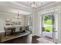 Formal dining room with hardwood floors, decorative lighting, and elegant decor perfect for entertaining guests at 147 Longleaf Dr, Canton, GA 30114