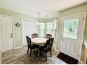 Breakfast nook with table and chairs situated in a sunny spot by the back door at 33 Bo Xing, Temple, GA 30179