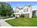Attractive two-story home with a lush green lawn, mature trees, and a double garage at 3485 Palisade Lake Dr, Duluth, GA 30096