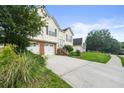 Charming residence featuring a well-manicured lawn, a double garage and mature trees at 3485 Palisade Lake Dr, Duluth, GA 30096