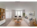 Bright living room with large windows, neutral tones, and comfortable seating at 2191 Phillips Rd, Lithonia, GA 30058