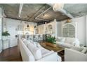 Elegant living room showcasing hardwood floors and a seamless transition to an open-concept kitchen at 3235 Roswell Ne Rd # 402, Atlanta, GA 30305