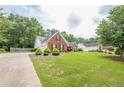 Beautiful brick home with well-maintained lawn, landscaping, and driveway at 2870 Jay Oak Dr, Dacula, GA 30019