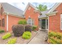 Inviting brick home featuring manicured shrubbery and a welcoming entrance at 2870 Jay Oak Dr, Dacula, GA 30019