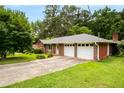 Spacious two-car garage attached to a well-maintained home with a long driveway at 5343 Crystal Ln, Atlanta, GA 30349