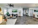 Bright and spacious open-concept living area with modern decor, stylish furniture, and wood-look floors at 236 Barfield Sw Ave, Atlanta, GA 30310
