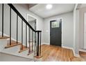 Foyer showcases hardwood floors, modern lighting, and a view of the front door at 4617 Cedar Park Dr, Stone Mountain, GA 30083
