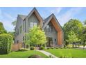 Charming two-story house with lush greenery, manicured lawn, and a welcoming walkway at 504 Barrington Drive, Roswell, GA 30075