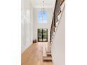 Grand two-story foyer with hardwood floors, staircase, and high ceilings at 504 Barrington Drive, Roswell, GA 30075