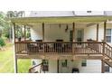 Spacious elevated deck, perfect for entertaining or relaxing with views of the private backyard and mature trees at 10 Stagg Trce, Social Circle, GA 30025