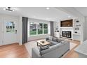 Bright living room with a fireplace, large windows, and contemporary furnishings at 3632 Glen Mora Dr, Decatur, GA 30032