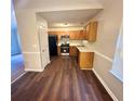 Functional kitchen equipped with stainless steel appliances, wood cabinets, and ample counter space at 4610 Idlewood Park, Lithonia, GA 30038
