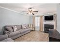 Comfortable living room featuring a fireplace, ceiling fan, and neutral decor at 6962 Gallant Circle Southeast Se Cir # 24, Mableton, GA 30126