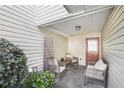 Cozy covered patio with comfortable seating and a privacy screen at 6962 Gallant Circle Southeast Se Cir # 24, Mableton, GA 30126