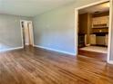 Bright living room with hardwood floors flowing into the kitchen at 1468 Spruce Se Dr, Smyrna, GA 30080