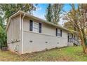 A charming home boasts a brick foundation and neutral siding at 1101 White Oak Ave, Atlanta, GA 30310