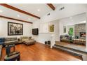 Open concept living room with stone fireplace, hardwood floors, and clerestory windows at 1164 Bonview Ne Ln, Atlanta, GA 30324