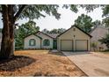 Charming exterior view of home with a two-car garage and updated landscaping at 515 Allens Landing Ct, Lawrenceville, GA 30045