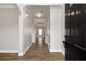 Inviting entryway showcasing a sleek, dark wood floor, neutral paint, and elegant trim at 829 Overlook Path Ln, Lawrenceville, GA 30045