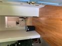 Inviting entryway featuring wood floors, neutral walls, and a glimpse into the bright laundry area at 2505 King Louis Rd, Conyers, GA 30012