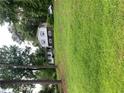 Charming two-story home with light-colored siding, blue shutters, and a spacious, well-maintained lawn at 2505 King Louis Rd, Conyers, GA 30012