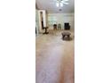 Spacious living room with neutral carpeting, ceiling fan, and seating arrangement at 999 Simonton Glen Dr, Lawrenceville, GA 30045