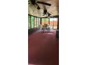 Enclosed sunroom with windows offering natural light and views of the backyard at 999 Simonton Glen Dr, Lawrenceville, GA 30045