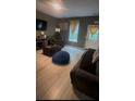 Inviting living room with hardwood floors, natural light, and cozy furnishings at 1794 Fielding Way, Hampton, GA 30228
