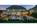 Outdoor oasis featuring a private pool, spa, and landscaped backyard perfect for relaxation at 2377 Kesgrove Way, Buford, GA 30518