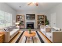 Cozy living room with a fireplace, plush sofas, and stylish decor, creating a relaxing atmosphere at 5421 Salem Springs Dr, Lithonia, GA 30038