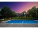 Spacious backyard pool with a diving board and plenty of room for lounging and entertaining at 1851 Harvest Way, Loganville, GA 30052