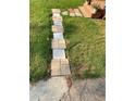 Stone pathway with grass on either side leads up to a wooden porch, adding charm at 2319 Beecher Sw Rd, Atlanta, GA 30311