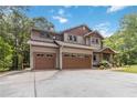 Stunning two-story home with a spacious driveway, a two-car garage, and beautifully landscaped front yard at 1268 Harris Road Rd, Lawrenceville, GA 30043